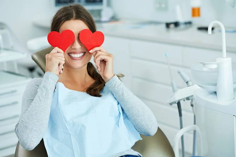 attractive-adult-woman-dentist-office-with-hearts.jpg