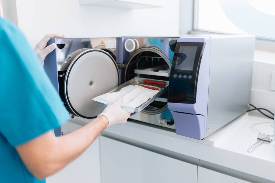 dentist-assistant-introducing-dentist-equipment-sterilization-machine.jpg dentist-assistant-introducing-dentist-equipment-sterilization-machine.jpg